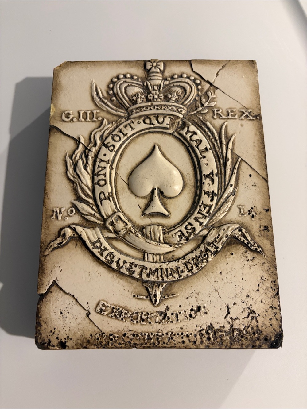 Sid Dickens “Passage” T-187. Cream Crest Plaque with Tan Emblem